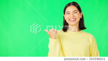 Portrait, pointing and branding with a woman on green screen space in studio for marketing or product placement. Hand gesture, advertising and options with an attractive young female on chromakey 103596831