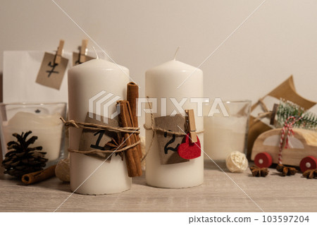 Candle with advent calendar Traditional Burning Christmas Wax Candles with numbers counting down for Christmas. Beautiful Advent At Home. Festive Candlelight And Dark Background 103597204