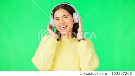 Face, green screen and woman with headphones, listen and movement on a studio background. Portrait, female dancer and person with headset, streaming music and excitement with stress relief and relax Face, green screen and woman with headphones, listen and movement on a studio background. Portrait, female dancer and person with headset, streaming music and excitement with stress relief and relax 103597208