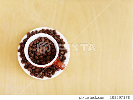 Coffee beans, roasted and cup for cafe industry with quality product and space for marketing or advertising. Above wooden table mockup background with grain as drink, espresso or caffeine ingredient 103597378