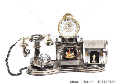 Vintage telephone with antique clock isolated on white Vintage telephone with antique clock isolated on white 103597422