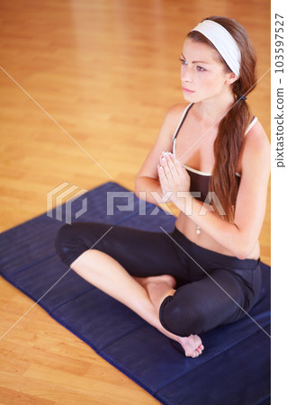 Woman, yoga meditation and prayer hands on floor for mindfulness, peace and exercise in home gym. Girl, zen training and praying pose for calm mindset, mental health and spiritual balance in house 103597527