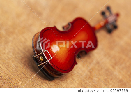 violin in vintage style on wood background violin in vintage style on wood background 103597589