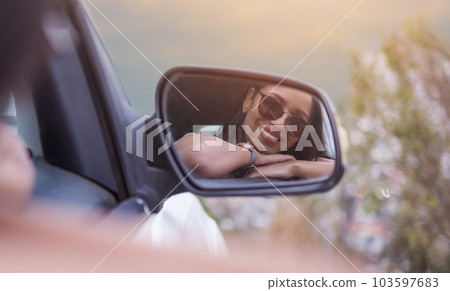 Ive never been happier. Shot of a beautiful young woman enjoying an adventurous ride in a car. Ive never been happier. Shot of a beautiful young woman enjoying an adventurous ride in a car. 103597683