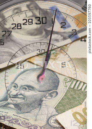 Stopwatch with International currencies inside. Time is money concept Stopwatch with International currencies inside. Time is money concept 103597760