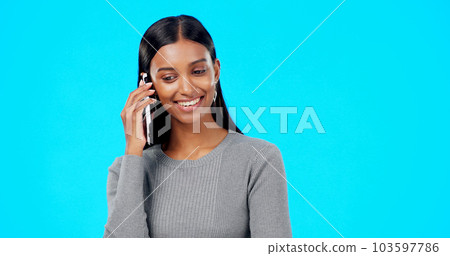 Happy, woman and phone call communication on blue background, studio and backdrop for contact. Indian female, model and talking on smartphone with smile, conversation and mobile networking discussion Happy, woman and phone call communication on blue background, studio and backdrop for contact. Indian female, model and talking on smartphone with smile, conversation and mobile networking discussion 103597786