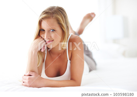 Relax, portrait and casual woman on a bed, resting and satisfied with a peaceful indoor morning. Face, smile and female lying down on the weekend, chilling and relaxed on day off in a bedroom Relax, portrait and casual woman on a bed, resting and satisfied with a peaceful indoor morning. Face, smile and female lying down on the weekend, chilling and relaxed on day off in a bedroom 103598180