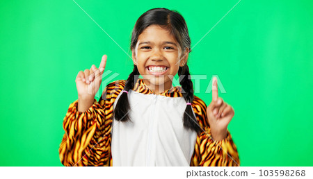 Face, motivation and girl with green screen, pointing and happiness with joy, cheerful and inspiration. Portrait, young person and female child with direction, decision and options with choice or joy 103598268