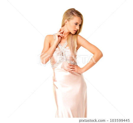 Beauty, fashion and elegant dress on a confident woman dressed for a wedding bridesmaid, prom or fancy event with copy space. Classy and beautiful female in a luxury pink designer gown with bling 103599445