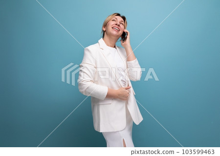 dreamy young caucasian blond lady in an elegant look 103599463