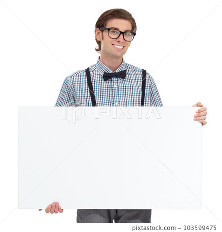 Portrait, smile and man with board for mockup in studio isolated on a white background. Poster, glasses and happy, funny person or nerd with copy space for advertising, marketing or promotion banner. 103599475
