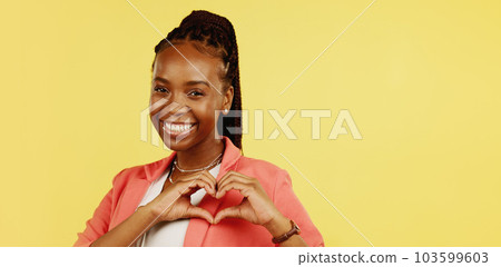 Heart hands, happy and love with black woman in studio for icon, confident and kindness. Gratitude, smile and emoji with girl and positive gesture for support, care and sign isolated on background Heart hands, happy and love with black woman in studio for icon, confident and kindness. Gratitude, smile and emoji with girl and positive gesture for support, care and sign isolated on background 103599603