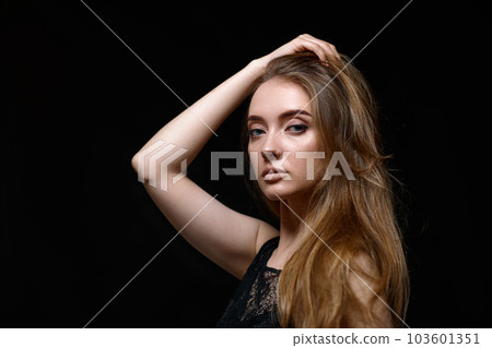 gorgeous brunette woman with long hair in black dress 103601351