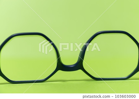 glasses frame on green background glasses frame on green background 103603000