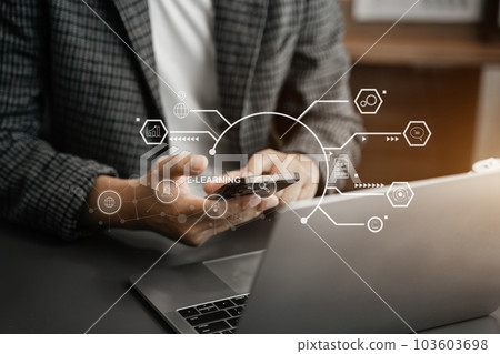 Elearning online working concept. Business man working on smartphone and laptop computer. 103603698