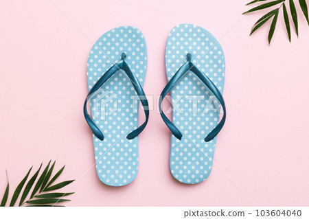 Flat lay composition with flip flops and seashell on colored background. Space for text top view Flat lay composition with flip flops and seashell on colored background. Space for text top view 103604040