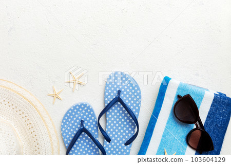 Summer vacation concept flat lay. straw hat beach accessories and towel top view. Space for text. travel concept 103604129