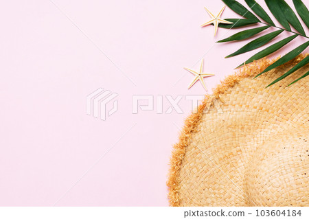 Summer holidays. Summer concept with straw hat and tropical leaf. Flat lay, top view, copy space Summer holidays. Summer concept with straw hat and tropical leaf. Flat lay, top view, copy space 103604184