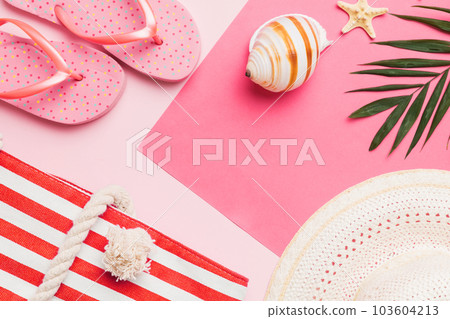 Beach accessories straw hat and seashell on colored table. Summer concept background 103604213