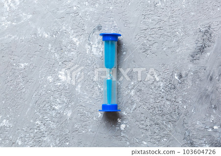 hourglass on the table, sand clock as time passing concept for business deadline, copy space 103604726