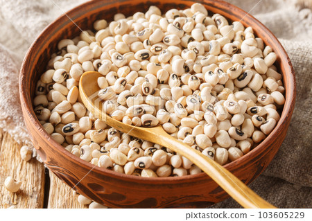 Health food concept Uncooked black eyed peas closeup. Horizontal Health food concept Uncooked black eyed peas closeup. Horizontal 103605229