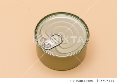 Unopened Tin Can with Blank Edge on Beige Background Unopened Tin Can with Blank Edge on Beige Background 103606445