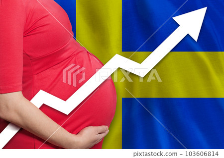 Swedish pregnant woman on flag of Sweden background. Birth rate up 103606814