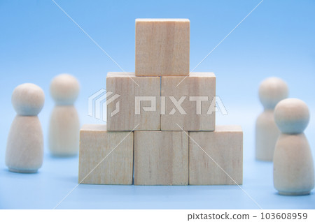 Stacking wooden cube on blue background with customizable space for text. Copy space 103608959