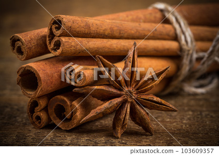 Close up of cinnamon sticks and star anise on wood 103609357