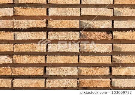 Stacked lumber background 103609752