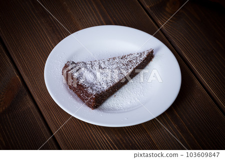 Chocolate Cake Slice on white dish 103609847