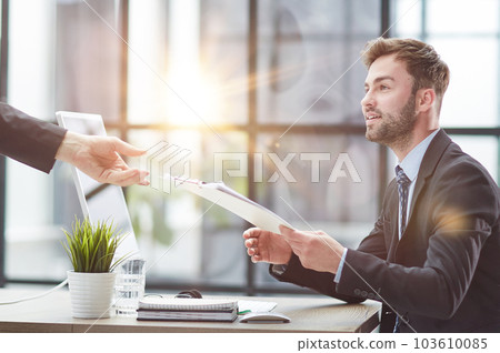 Close Up Of Businessman Taking Folders From Hand Close Up Of Businessman Taking Folders From Hand 103610085