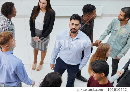 a large group of people meet in the office corridor. office life a large group of people meet in the office corridor. office life 103610222
