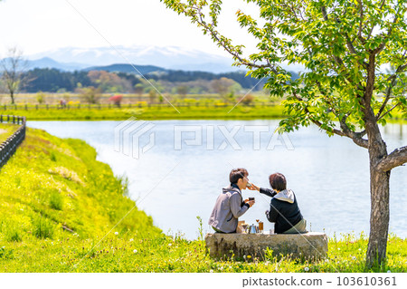 A couple taking a coffee break Park Lake 103610361