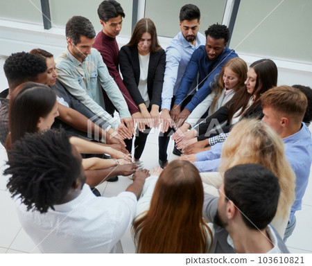 Narrow banner of multiracial people stack hands motivated for shared business success or goal achievement. 103610821
