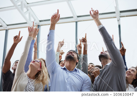 happy group of diverse young people holding their hands up 103610847