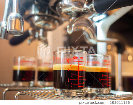 perfect double shot espresso hot black coffee crema aroma morning glass cup drink espresso machine coffee maker fresh cafe caffeine brown beverage barista bar breakfast background selected focus 103611126