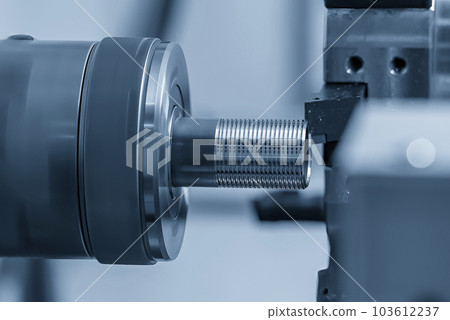 Close up scene the CNC lathe machine thread cutting at the end of metal pipe parts. Close up scene the CNC lathe machine thread cutting at the end of metal pipe parts. 103612237