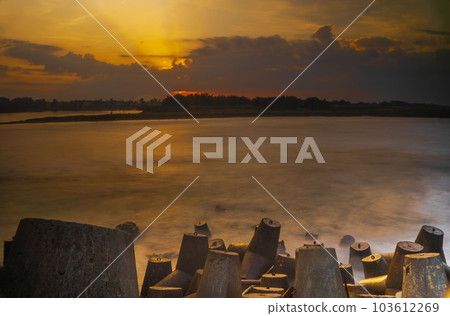 Tetrapods or breakwaters on the Glagah Beach, Kulonprogo, Indonesia during sunrise. Tetrapods or breakwaters on the Glagah Beach, Kulonprogo, Indonesia during sunrise. 103612269