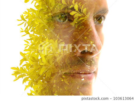 Double exposure closeup portrait of a man's face and light green leafy stems Double exposure closeup portrait of a man's face and light green leafy stems 103613064