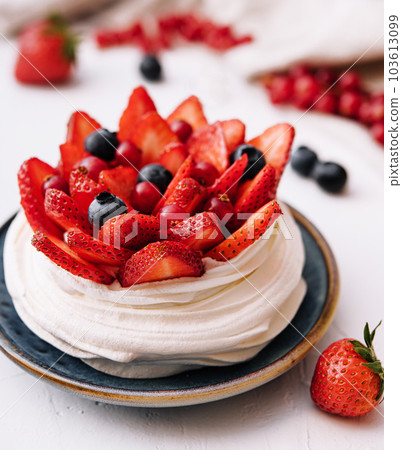 Plate with delicious strawberry cake on table Plate with delicious strawberry cake on table 103613099