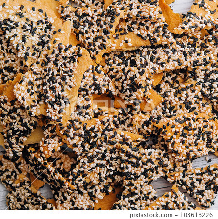 Salted tortilla chips triangle with chia seeds on top view 103613226