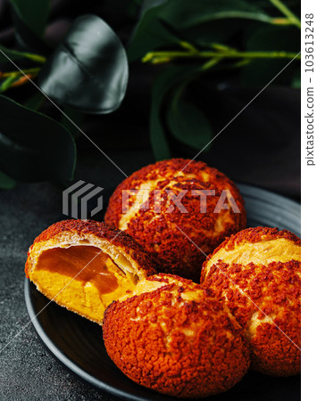 PoofPoof Butterscotch on black plate on stone PoofPoof Butterscotch on black plate on stone 103613248