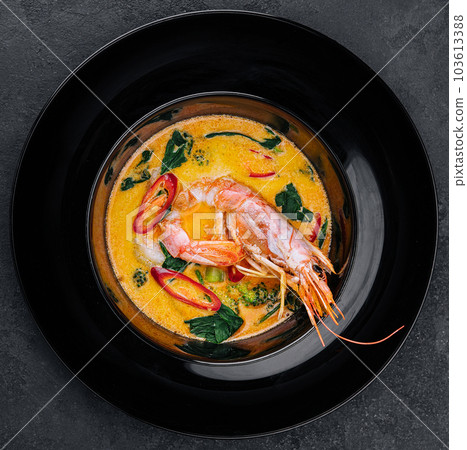 Tom yam is a spicy soup with shrimp. Restaurant soup food. 103613388