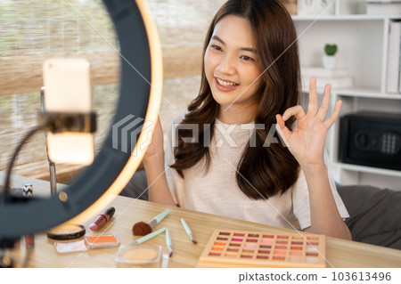 Beautiful women with social media influences recommend products and make-up accessories to be more beautiful, Recording vlog video live streaming, Online business of beauty bloggers. Beautiful women with social media influences recommend products and make-up accessories to be more beautiful, Recording vlog video live streaming, Online business of beauty bloggers. 103613496