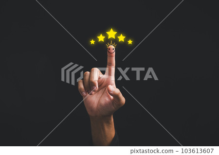 Businessman pointing five stars to assess customer satisfaction and service quality by pointing to the highest level icon on black background, ensuring positive feedback, give 5 star for good service Businessman pointing five stars to assess customer satisfaction and service quality by pointing to the highest level icon on black background, ensuring positive feedback, give 5 star for good service 103613607