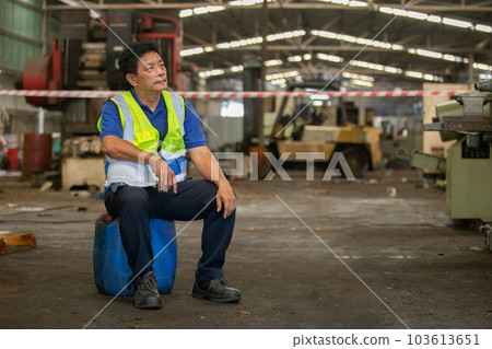 Senior male Industrial factory workers are exhausted and stressed from hard work. Senior male Industrial factory workers are exhausted and stressed from hard work. 103613651