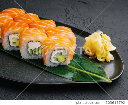Philadelphia Sushi on black dish 103613792