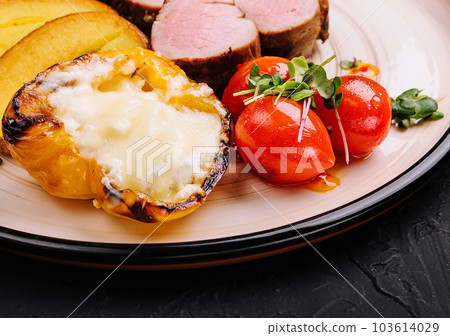 turkey tenderloin with potatoes and roasted peppers 103614029