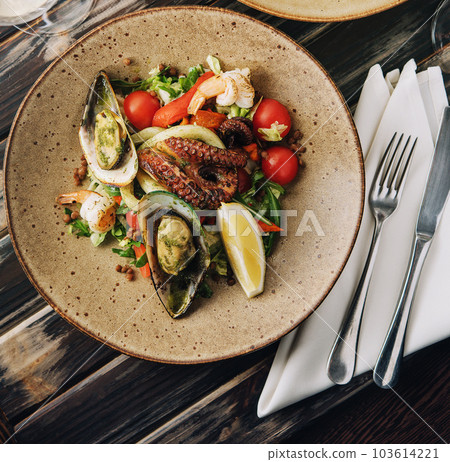 Top view seafood dishes on wooden table 103614221